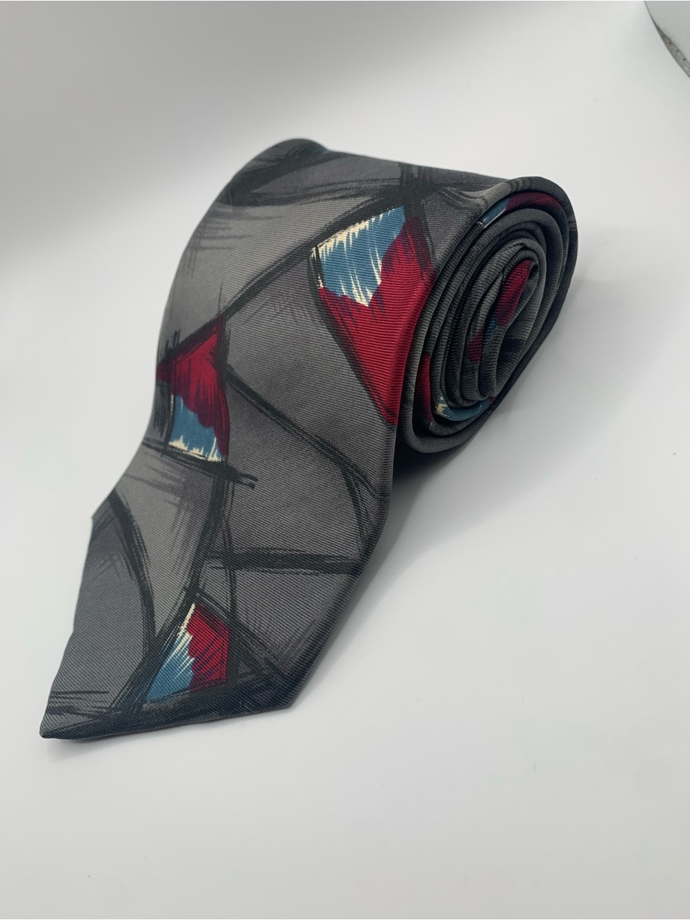 Gray Men's Tie with Red and Blue Abstract Accents